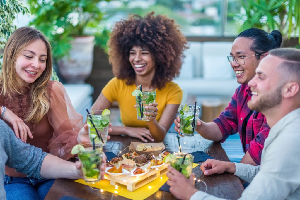 Multiracial,Group,Of,Friends,Enjoying,Mojito,In,Bar,Restaurant,At