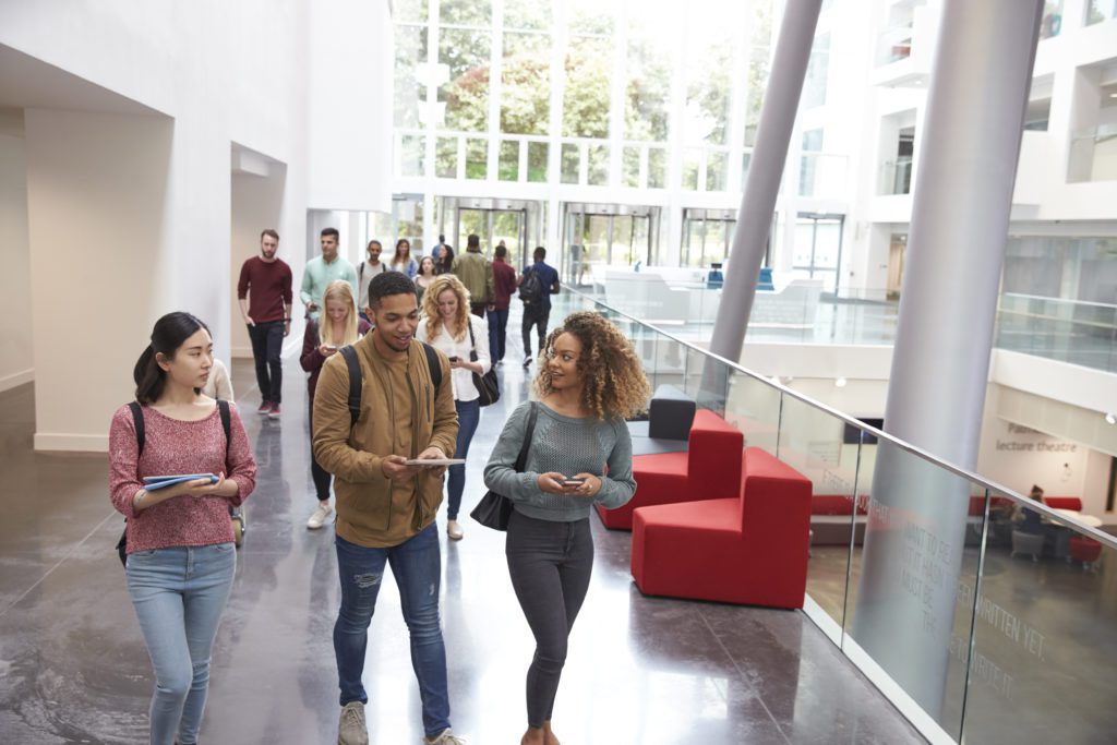 Students,Walk,And,Talk,Using,Mobile,Devices,In,University