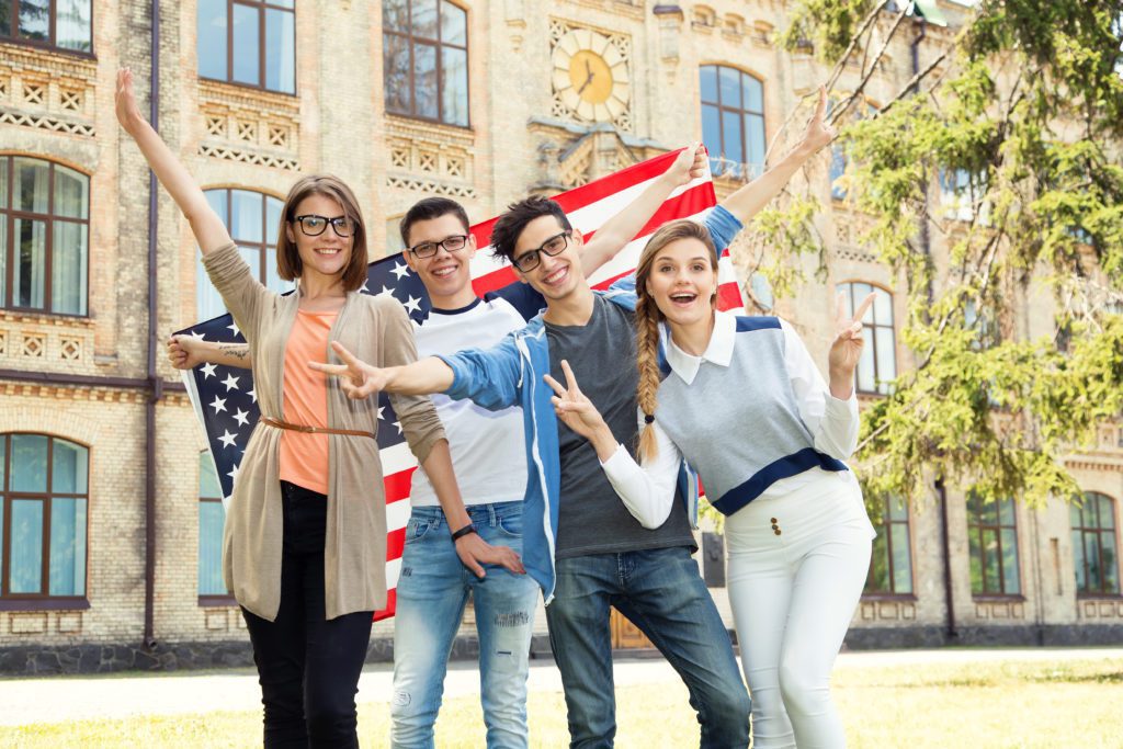 Group,Of,Students,Holding,Flag,Of,Usa,On,The,University