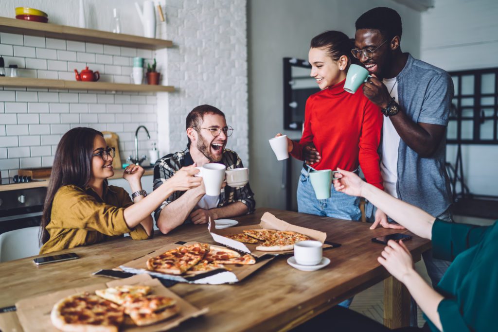 Joyful,Young,Multiethnic,People,In,Casual,Clothes,Relishing,Of,Pizza