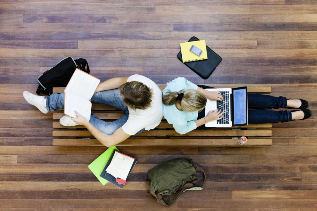 Top,View,Of,Male,And,Female,University,Students,Studying