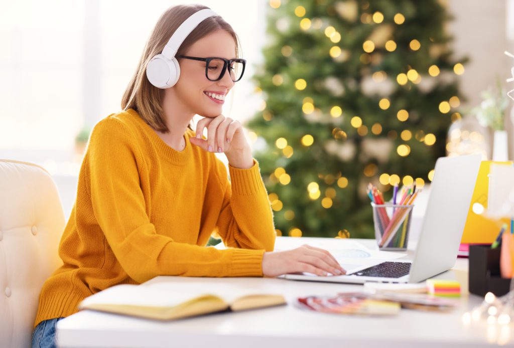 student studying next to the christmas tree