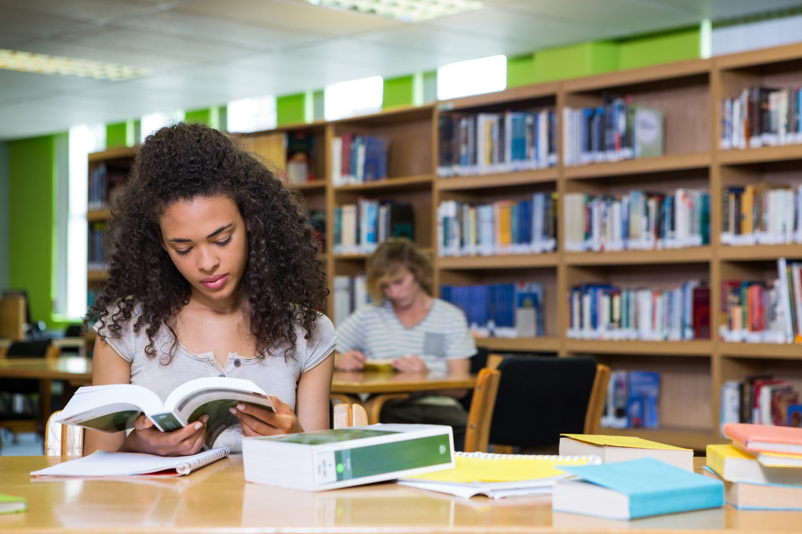 Student studying in the library at university