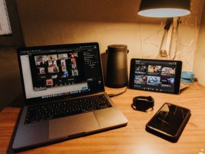 a laptop and ipad with a group call