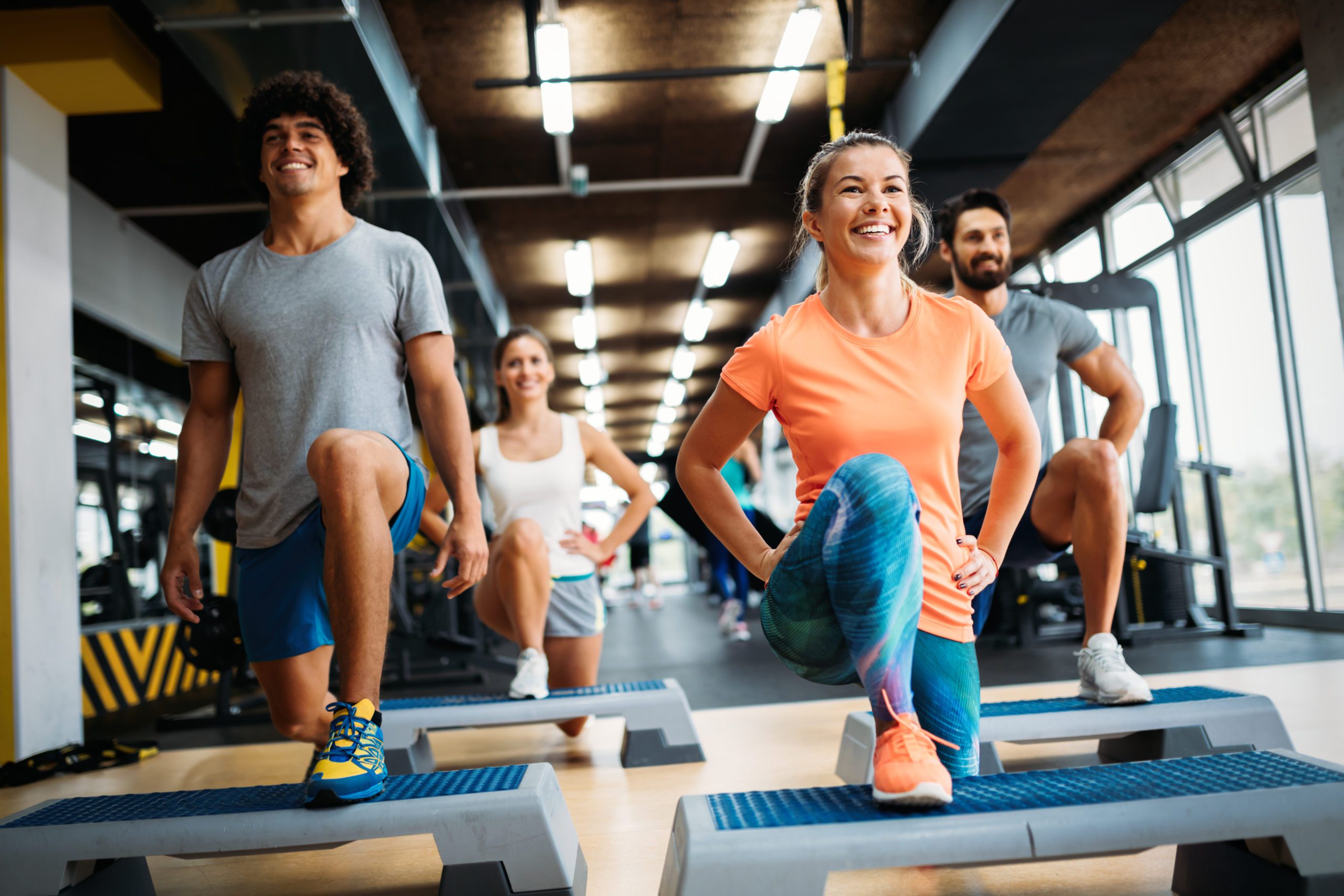 Group,Of,Young,People,Doing,Exercises,In,Gym