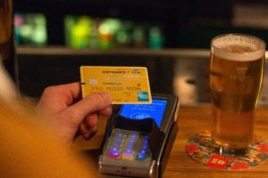 a person paying for alcohol via c
