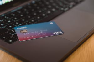 a revolut bank card resting on a laptop