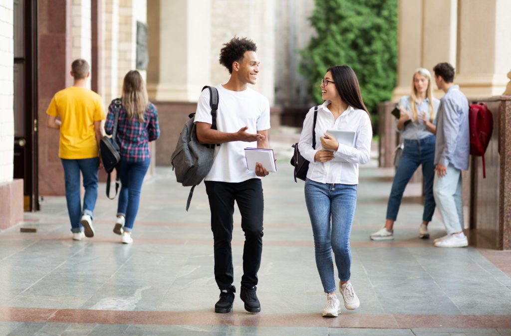 two friends at university going for a walk to de-stress