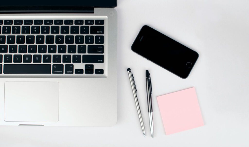 iphone-and-sticky-notes-beside-macbook