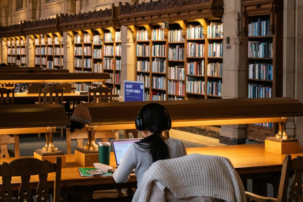 Student revising in library.